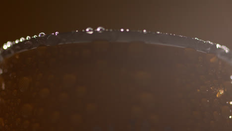 Close-Up-Backlit-Shot-Of-Condensation-Droplets-On-Revolving-Takeaway-Can-Of-Cold-Beer-Or-Soft-Drink-3